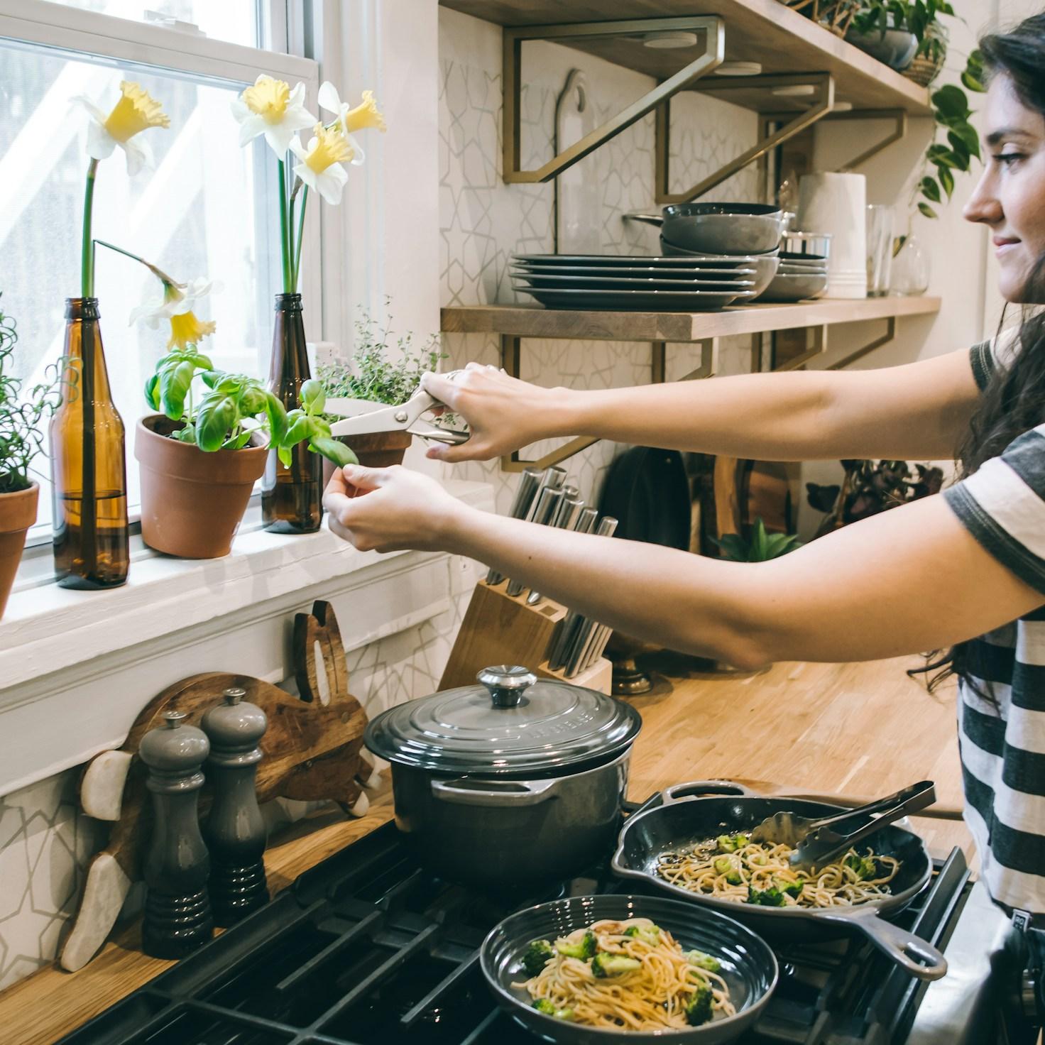 Community members collaborating in a modern kitchen space, sharing recipes and cooking techniques